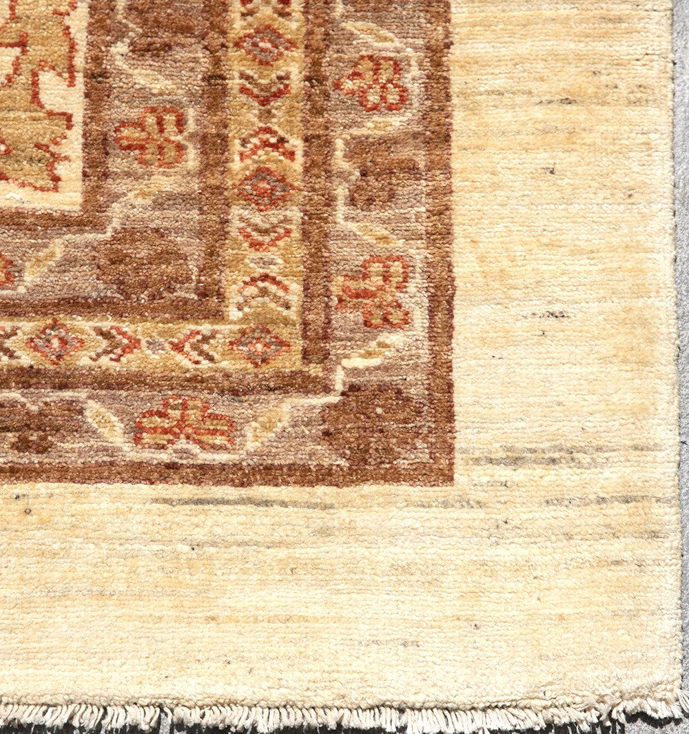 Oversized 14x19 hand-knotted Oushak rug in soft gold and antique tones, featuring floral palmette motifs and crafted from hand-spun Afghan wool by Ariana Rugs.