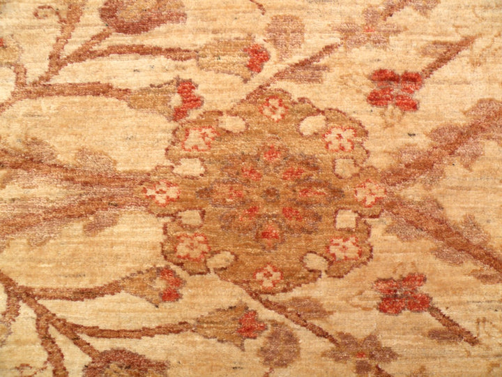 Oversized 14x19 hand-knotted Oushak rug in soft gold and antique tones, featuring floral palmette motifs and crafted from hand-spun Afghan wool by Ariana Rugs.
