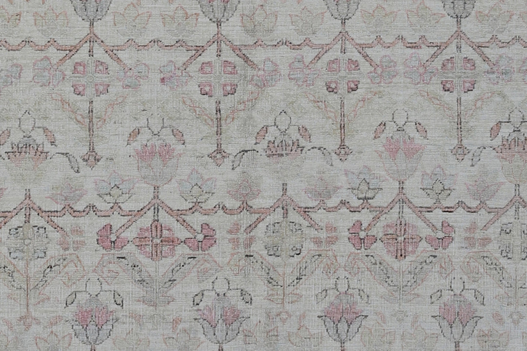 Authentic Ariana Traditional Collection 5x8 wool area rug featuring a traditional overall design pattern in earth tones and soft pink accents, hand-knotted in Afghanistan.