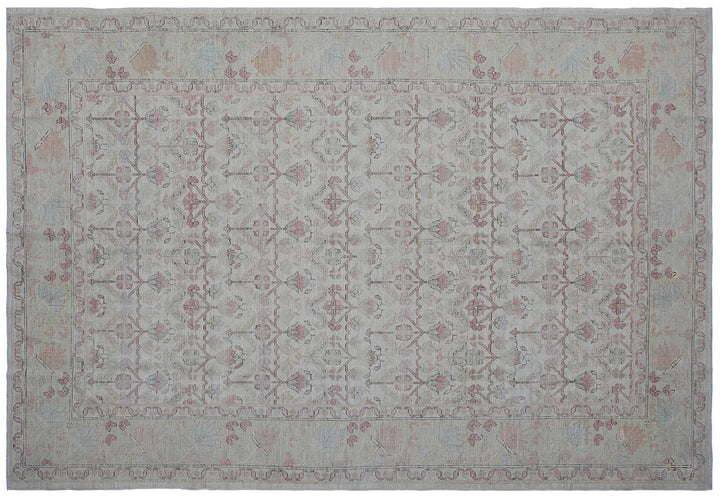 Authentic Ariana Traditional Collection 5x8 wool area rug featuring a traditional overall design pattern in earth tones and soft pink accents, hand-knotted in Afghanistan.
