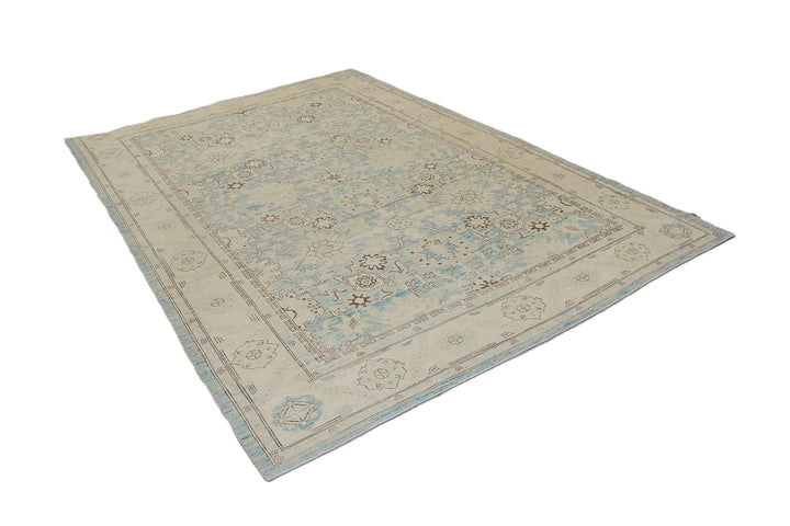 Authentic Ariana Traditional Collection 9x12 wool area rug featuring a classical Sultanabad design on a deep blue background field, hand-knotted in Afghanistan.