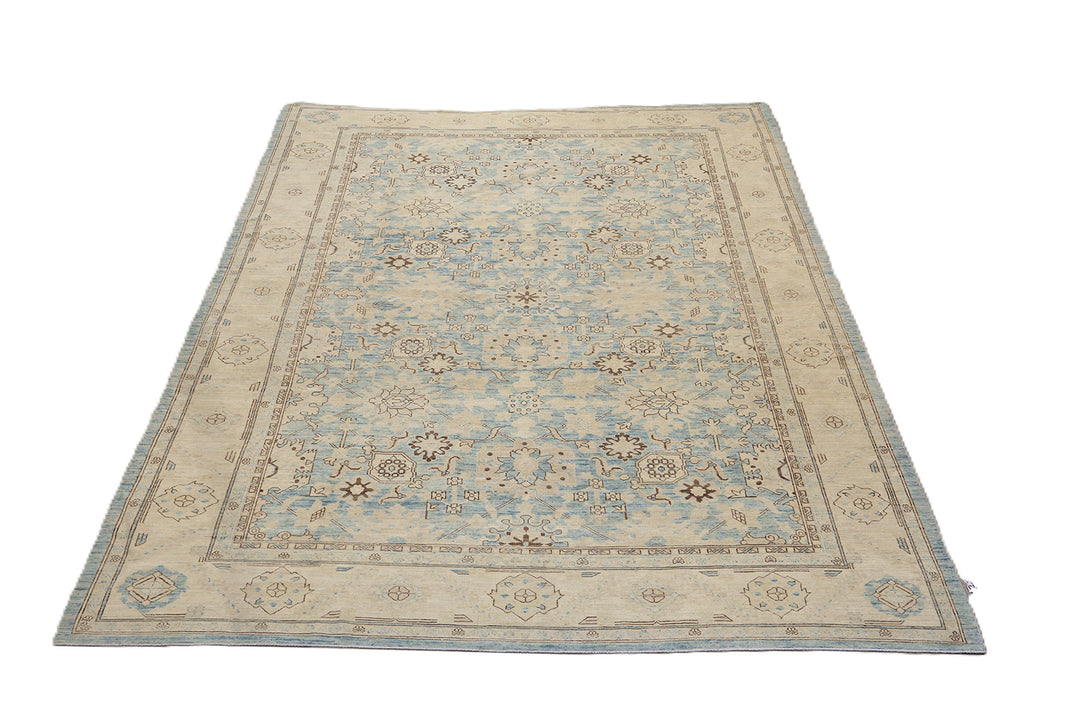 Authentic Ariana Traditional Collection 9x12 wool area rug featuring a classical Sultanabad design on a deep blue background field, hand-knotted in Afghanistan.