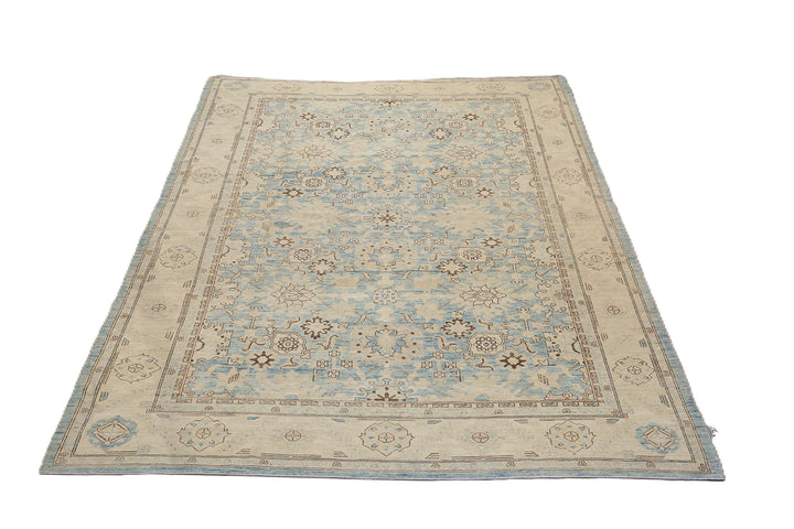 Authentic Ariana Traditional Collection 9x12 wool area rug featuring a classical Sultanabad design on a deep blue background field, hand-knotted in Afghanistan.