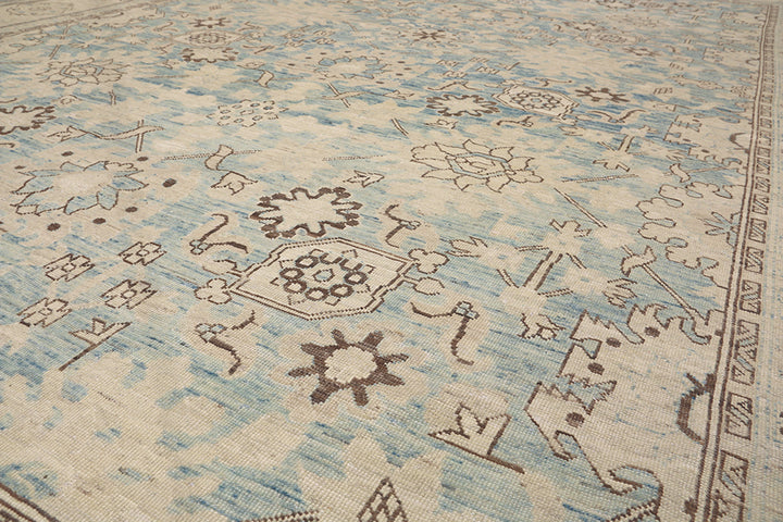 Authentic Ariana Traditional Collection 9x12 wool area rug featuring a classical Sultanabad design on a deep blue background field, hand-knotted in Afghanistan.