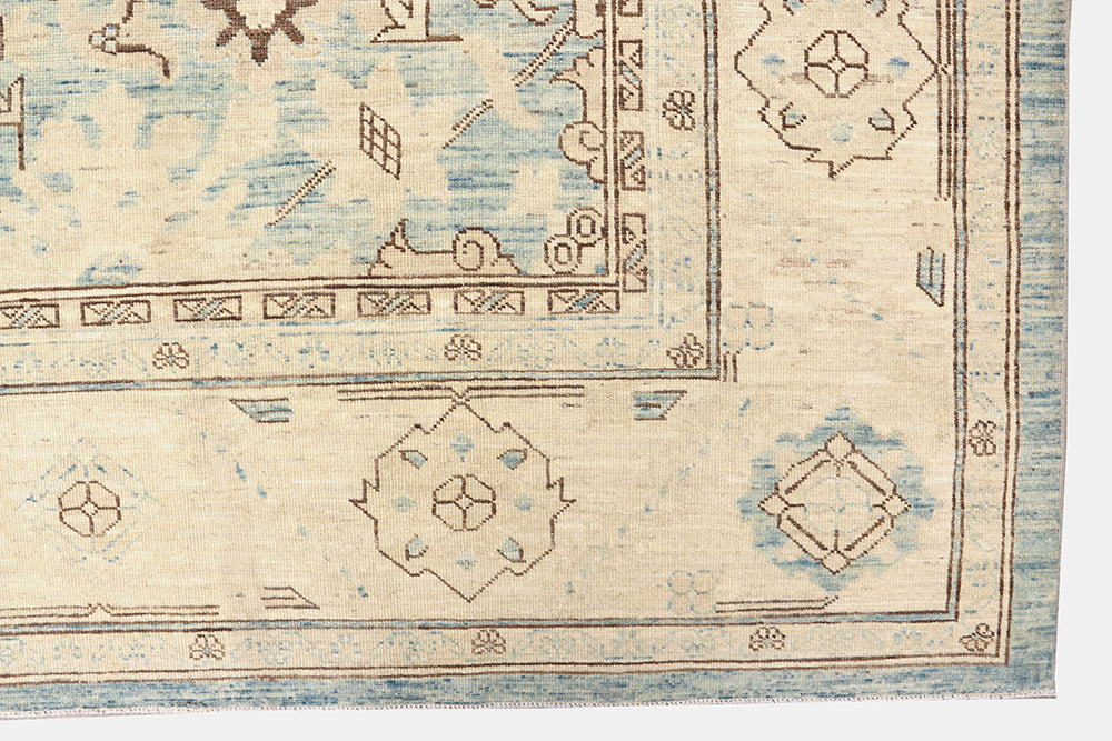 Authentic Ariana Traditional Collection 9x12 wool area rug featuring a classical Sultanabad design on a deep blue background field, hand-knotted in Afghanistan.