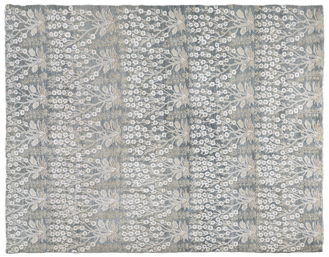 Ariana Transitional 8x11 hand-knotted Afghan wool rug featuring a directional blue millfleur tree design with stark white cotton floral accents.