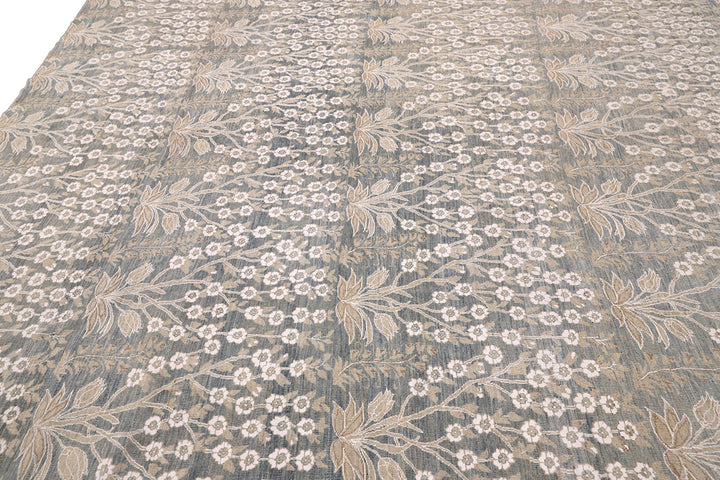 Ariana Transitional 8x11 hand-knotted Afghan wool rug featuring a directional blue millfleur tree design with stark white cotton floral accents.
