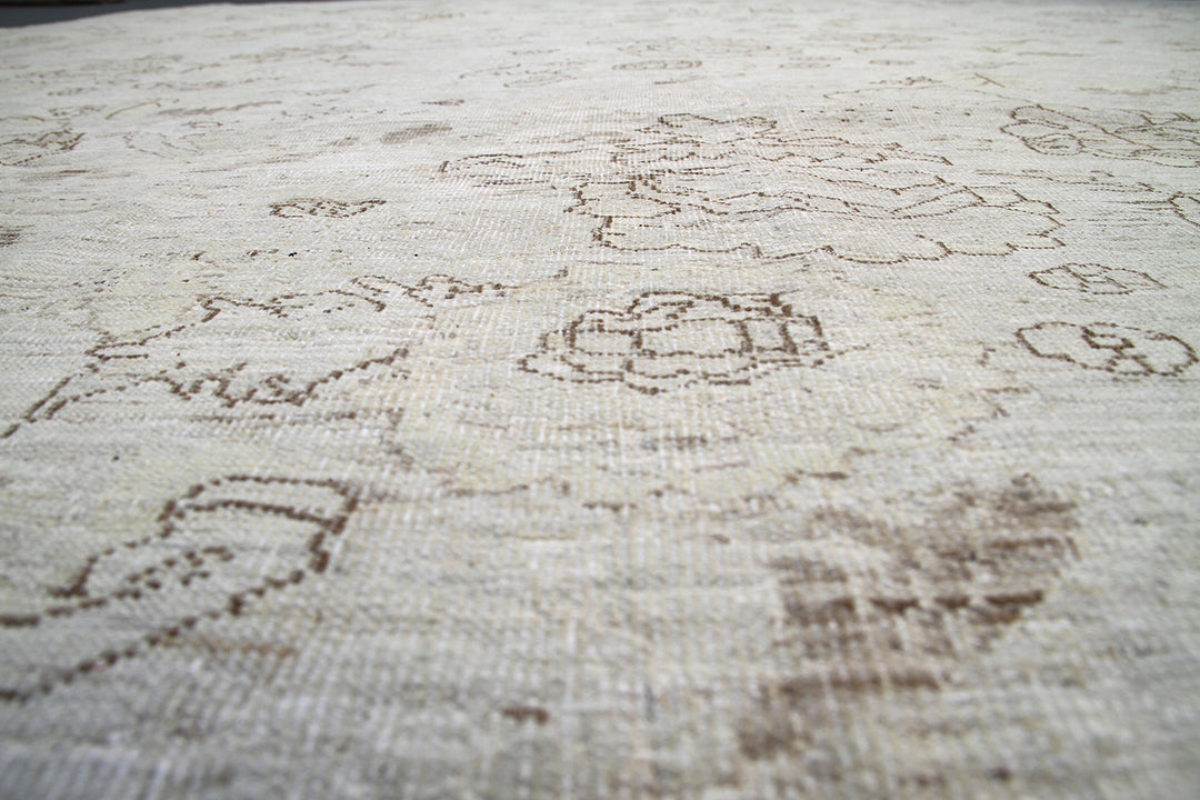 Ariana Transitional Collection 8'9"x11'5" hand-knotted organic wool Afghan rug in light cream and cafe brown with a vintage floral design.