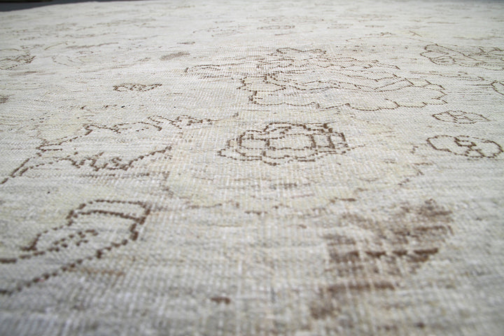 Ariana Transitional Collection 8'9"x11'5" hand-knotted organic wool Afghan rug in light cream and cafe brown with a vintage floral design.