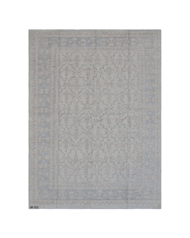 Authentic Ariana Transitional Collection 5x7 wool area rug featuring an ivory and cream geometric pattern with blue accents, ethically hand-knotted in Afghanistan.