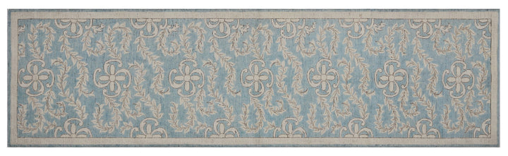 Authentic hand-knotted Afghan runner rug from Ariana Rugs, featuring an intricate floral design in blue and beige organic wool.