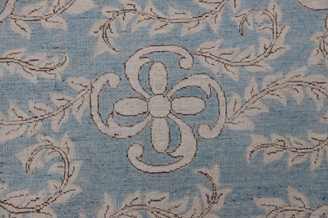 Authentic hand-knotted Afghan runner rug from Ariana Rugs, featuring an intricate floral design in blue and beige organic wool.