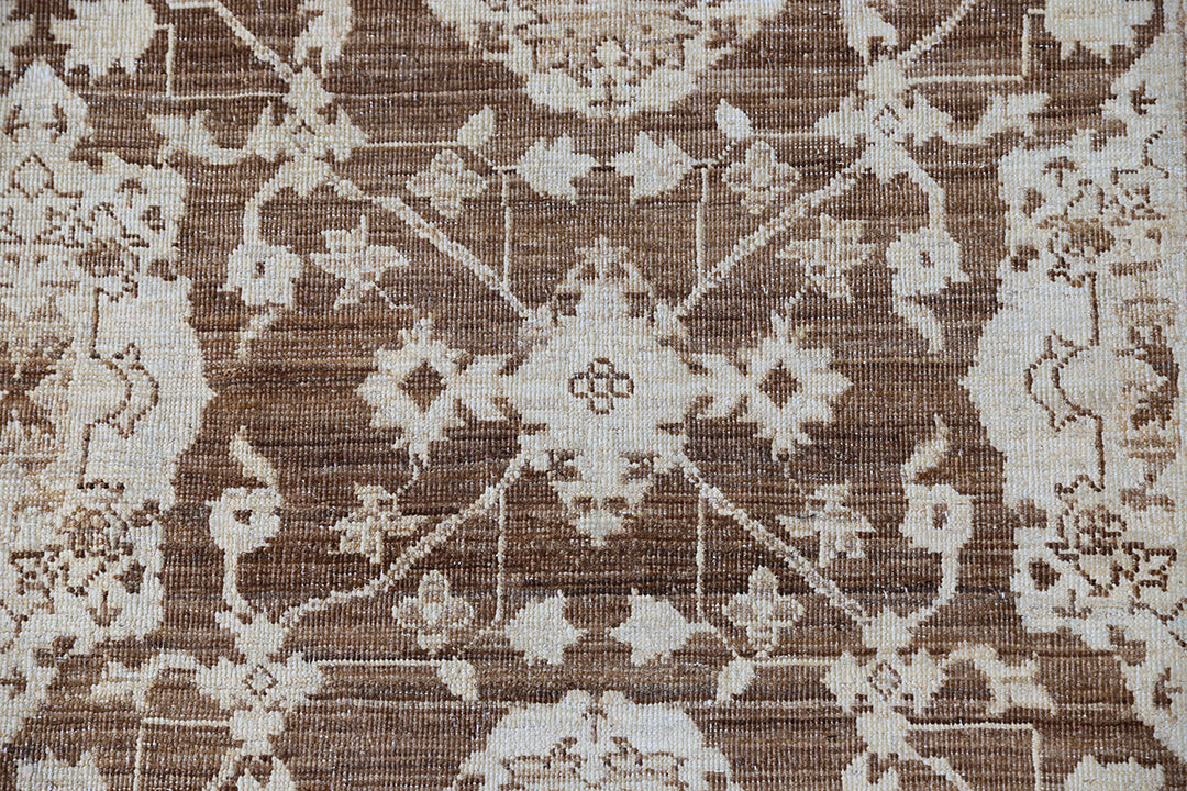 Authentic fine hand-knotted Afghan area rug from the Ariana Traditional Collection, featuring the Agra 505 design in low-pile warm brown and cream organic wool.