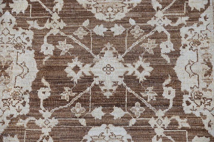 Authentic fine hand-knotted Afghan area rug from the Ariana Traditional Collection, featuring the Agra 505 design in low-pile warm brown and cream organic wool.