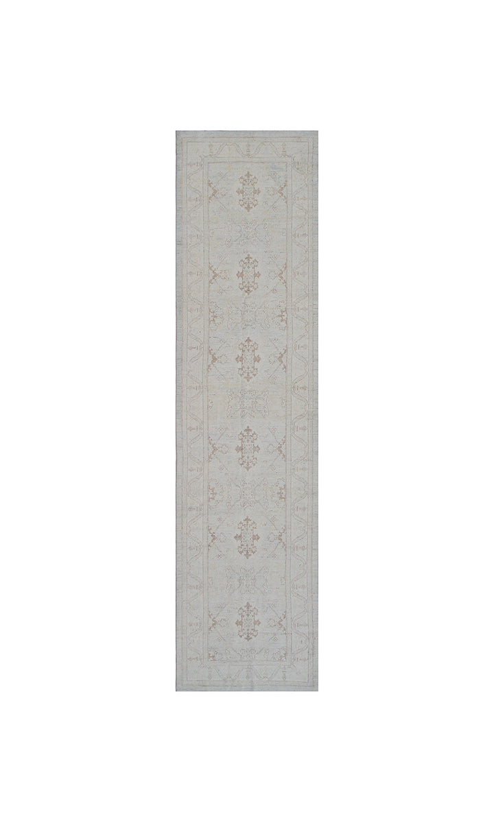 Authentic hand-knotted Afghan runner rug from the Ariana Transitional Collection, featuring the Agra 505 design in low-pile soft blue organic wool.
