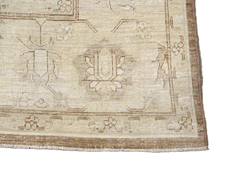 One-of-a-kind hand-knotted organic wool rug in Agra 505 design, featuring muted brown earthtone colors from the Ariana Vintage Traditional Collection.