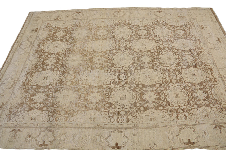 One-of-a-kind hand-knotted organic wool rug in Agra 505 design, featuring muted brown earthtone colors from the Ariana Vintage Traditional Collection.
