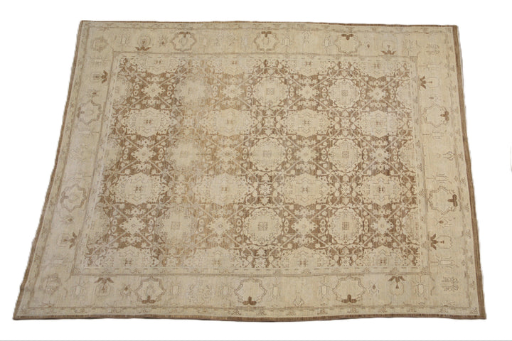 One-of-a-kind hand-knotted organic wool rug in Agra 505 design, featuring muted brown earthtone colors from the Ariana Vintage Traditional Collection.
