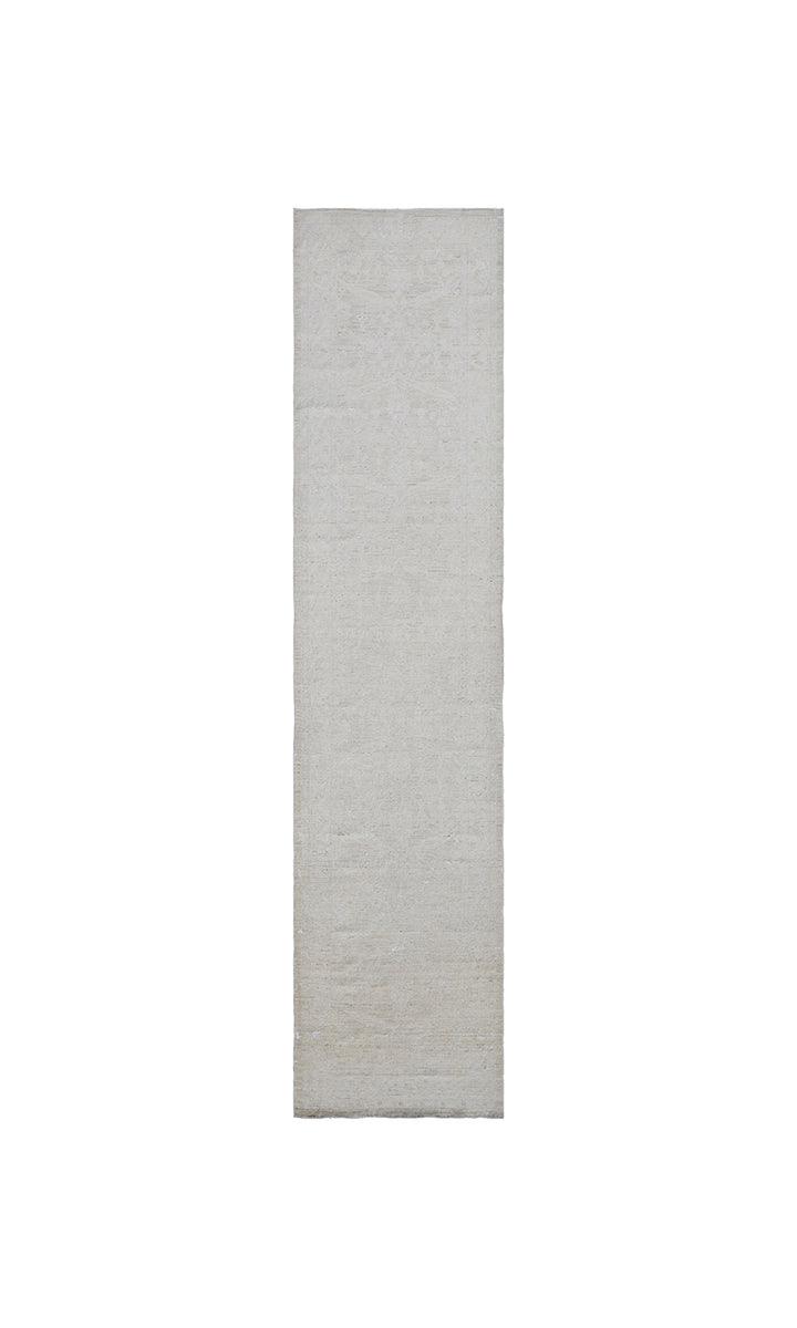 Authentic hand-knotted Afghan runner rug from the Ariana Vintage Collection, featuring a brand-new, beautifully distressed geometric design in pale, muted organic wool tones.