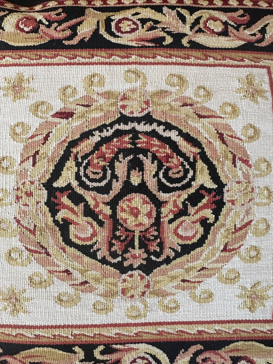 Handmade 19x19 black, red, and gold Aubusson style throw pillowcase with corner tassels by Ariana Rugs West Hollywood