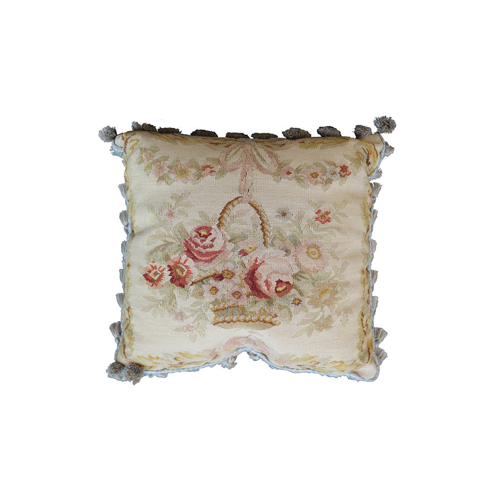 Handmade 19x19 cream wool and cotton Aubusson pillowcase with white tassels featuring a flower basket by Ariana Rugs West Hollywood