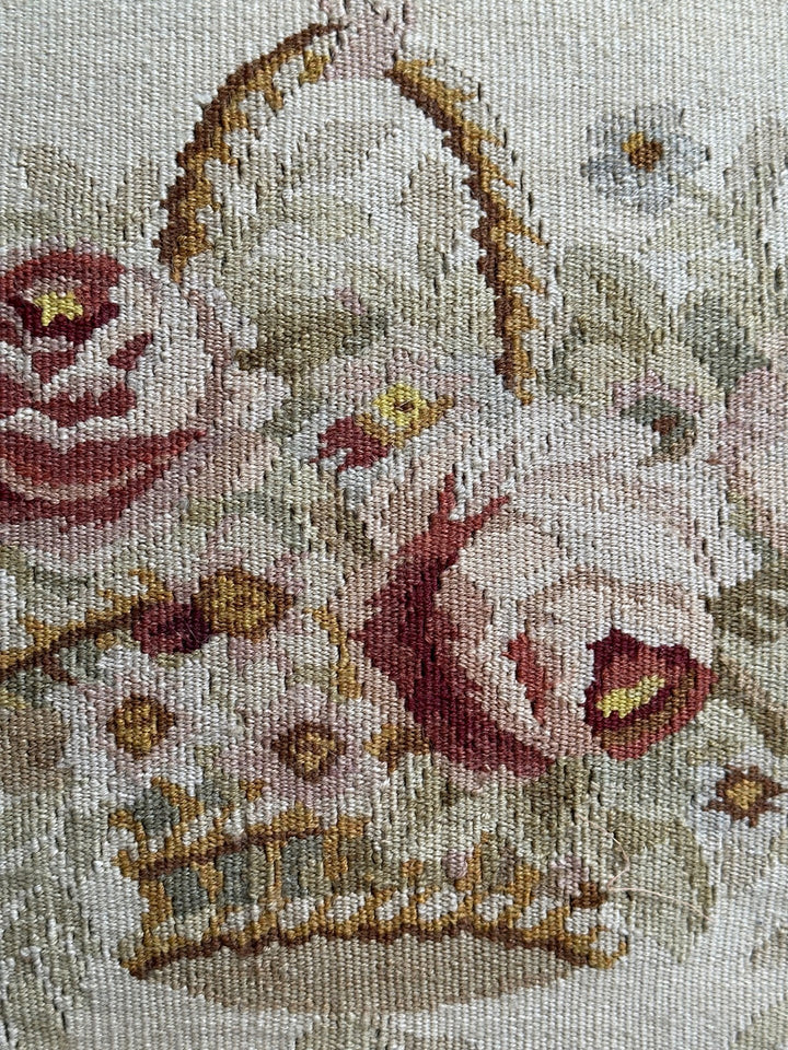Handmade 19x19 cream wool and cotton Aubusson pillowcase with white tassels featuring a flower basket by Ariana Rugs West Hollywood