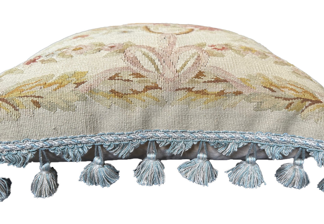 Handmade 19x19 cream wool and cotton Aubusson pillowcase with white tassels featuring a flower basket by Ariana Rugs West Hollywood