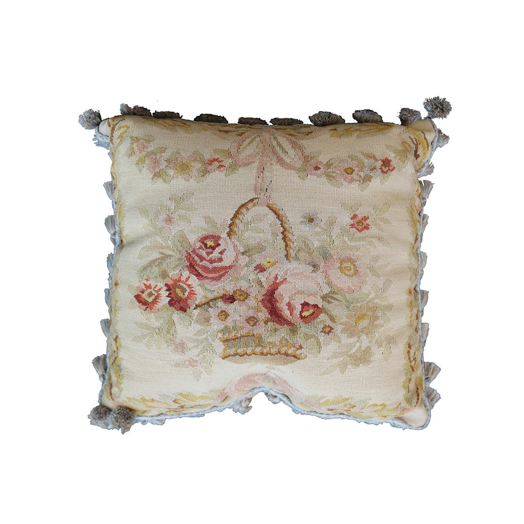 Handmade 19x19 cream wool and cotton Aubusson pillowcase with white tassels featuring a flower basket by Ariana Rugs West Hollywood