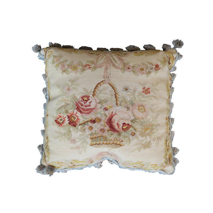 Handmade 19x19 cream wool and cotton Aubusson pillowcase with white tassels featuring a flower basket by Ariana Rugs West Hollywood