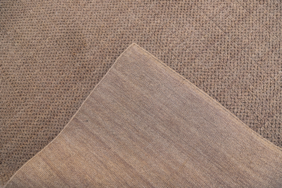 Large 10x14 brown hand-loomed wool area rug from the Diamond Collection with a textured loop pile.