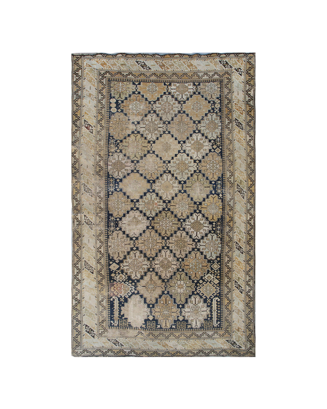 Distressed antique Caucasian Shirvan wool rug featuring geometric motifs in navy blue and tan with heavy distress and authentic age patina