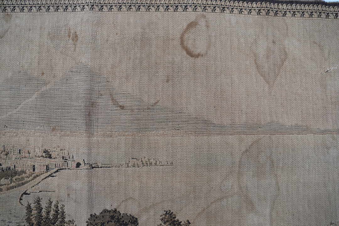 Early 20th-century power-loomed French tapestry featuring a scenic coastal city landscape, measuring 2 feet by 5 feet