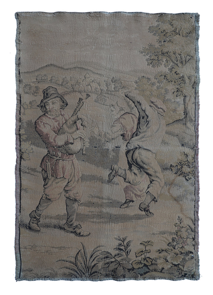 Early 20th-century French power-loomed tapestry depicting a man playing a pipe instrument and a man dancing in a pastoral setting, measuring 3 feet by 4 feet