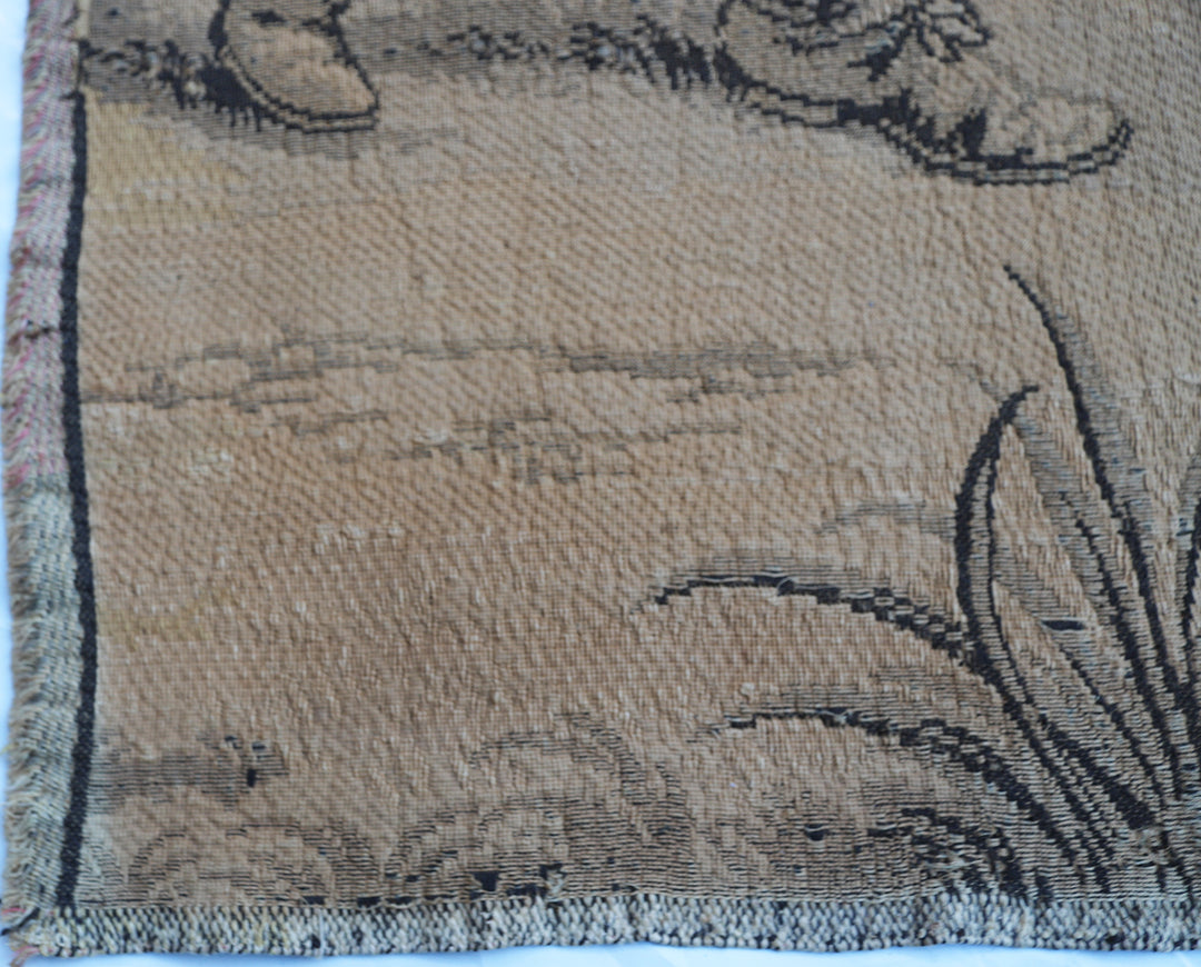 Early 20th-century French power-loomed tapestry depicting a man playing a pipe instrument and a man dancing in a pastoral setting, measuring 3 feet by 4 feet