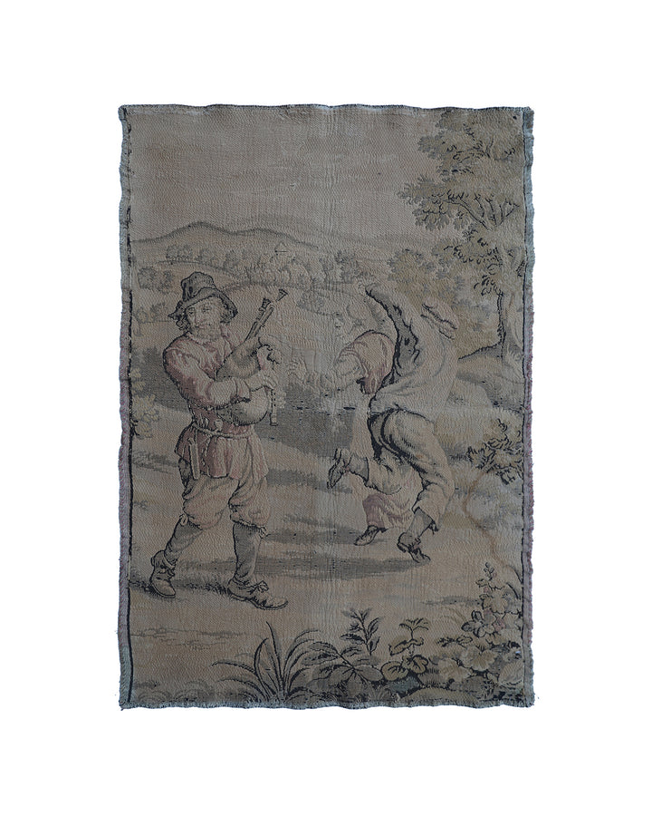 Early 20th-century French power-loomed tapestry depicting a man playing a pipe instrument and a man dancing in a pastoral setting, measuring 3 feet by 4 feet