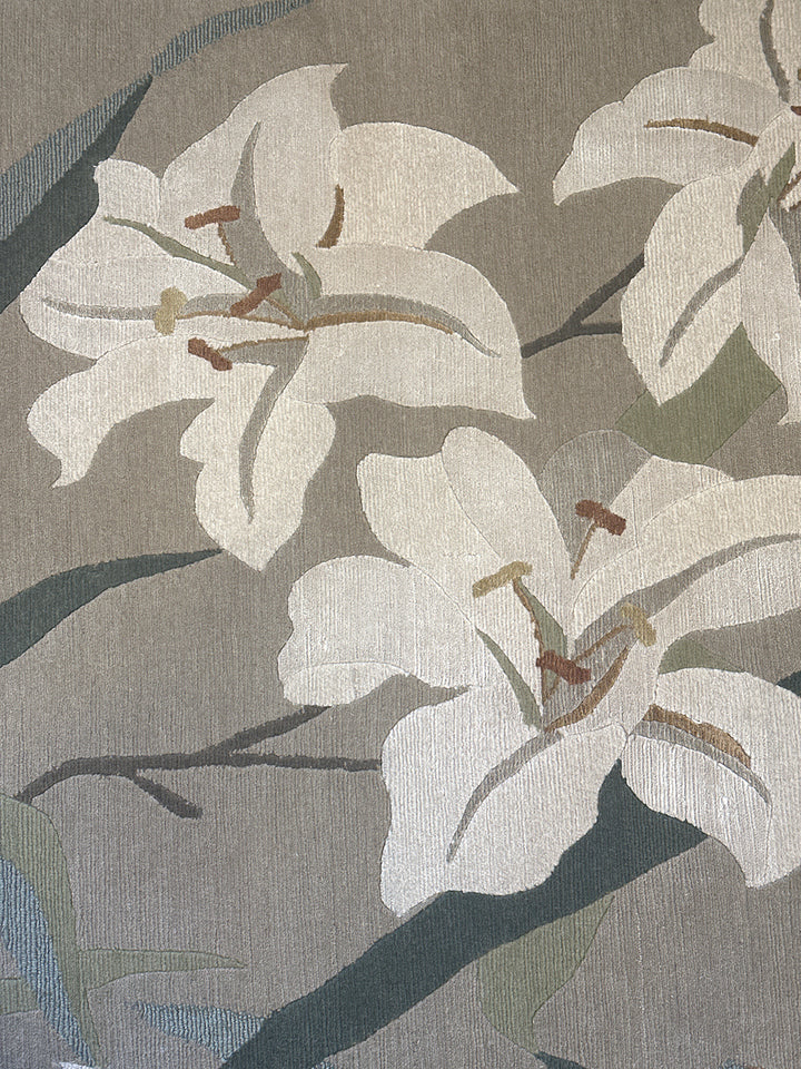 One-of-a-kind 6x9 hand-knotted Tibetan wool and silk rug with a green background and white floral design.