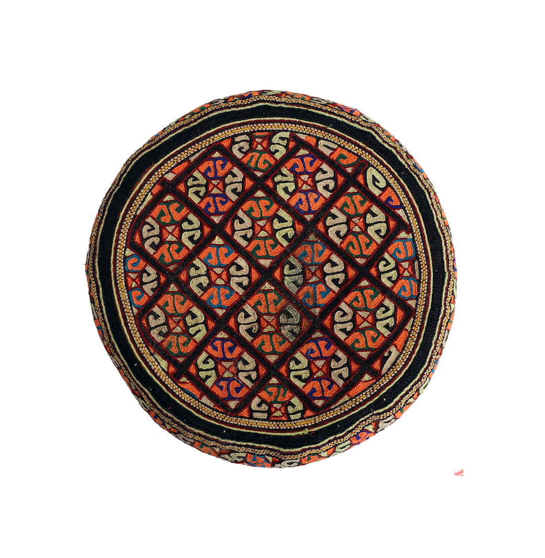 Decorative hat with geometric pattern on a white background