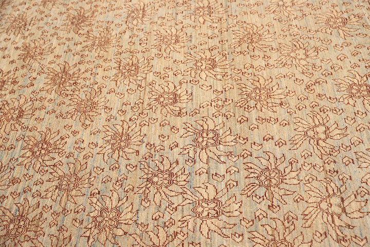 8'x10' Ariana Transitional Collection icy blue and terra cotta borderless floral wool area rug styled in a modern living room