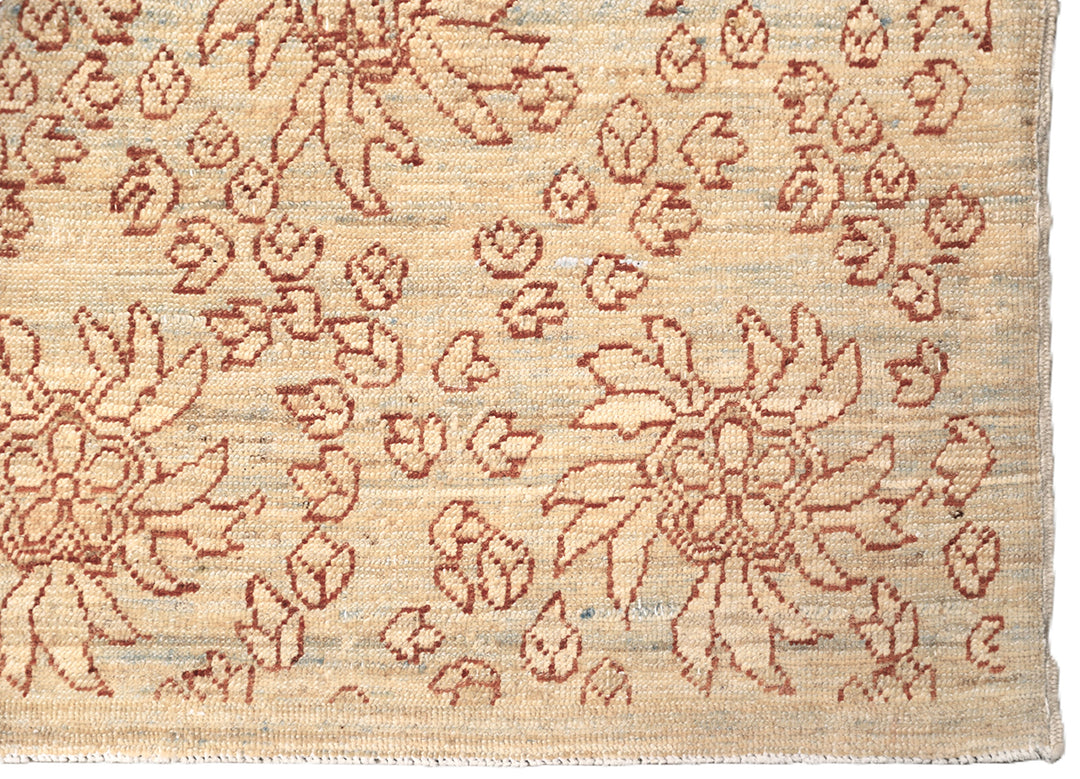 8'x10' Ariana Transitional Collection icy blue and terra cotta borderless floral wool area rug styled in a modern living room