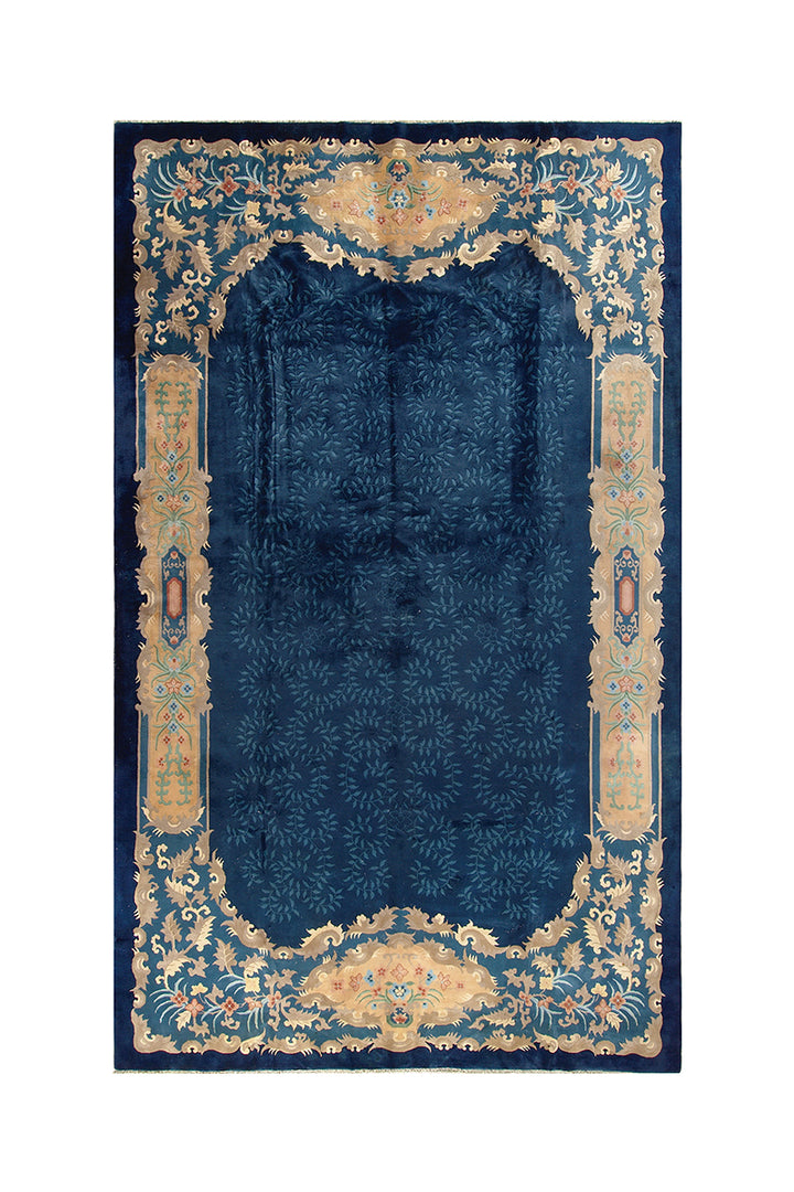Decorative blue rug with gold intricate border on a white background