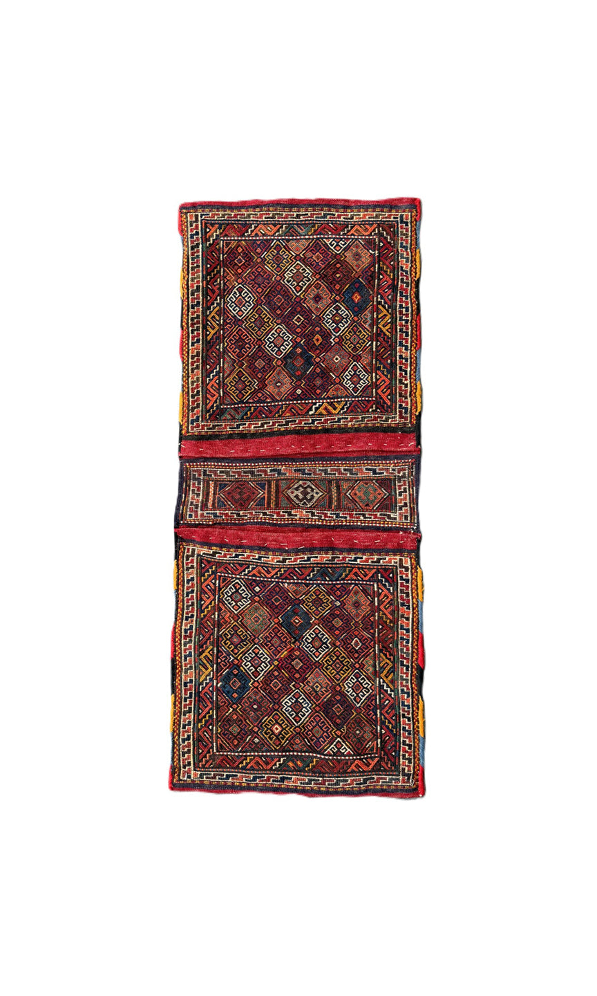 Handwoven Persian tribal storage saddle bag with geometric patterns in wool.