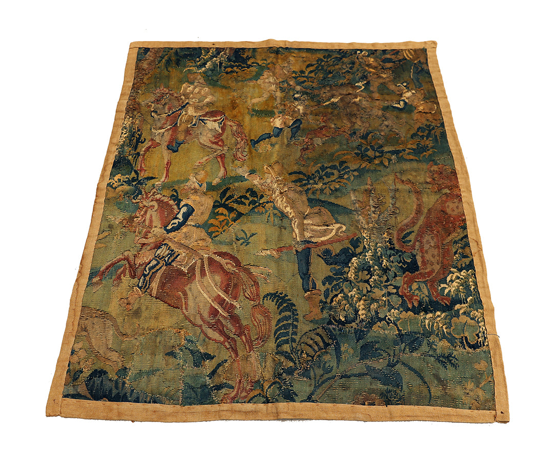 Vintage tapestry with historical scene of a warrior on horseback and animals, displayed flat.