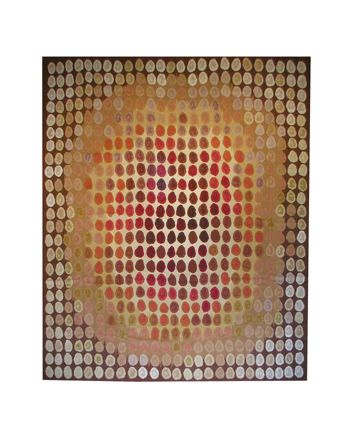A wide-angle shot of a multi-colored contemporary handwoven Aubusson rug featuring a geometric pattern, showcasing the luxurious sheen of the silk and wool blend in a well-lit modern living room.