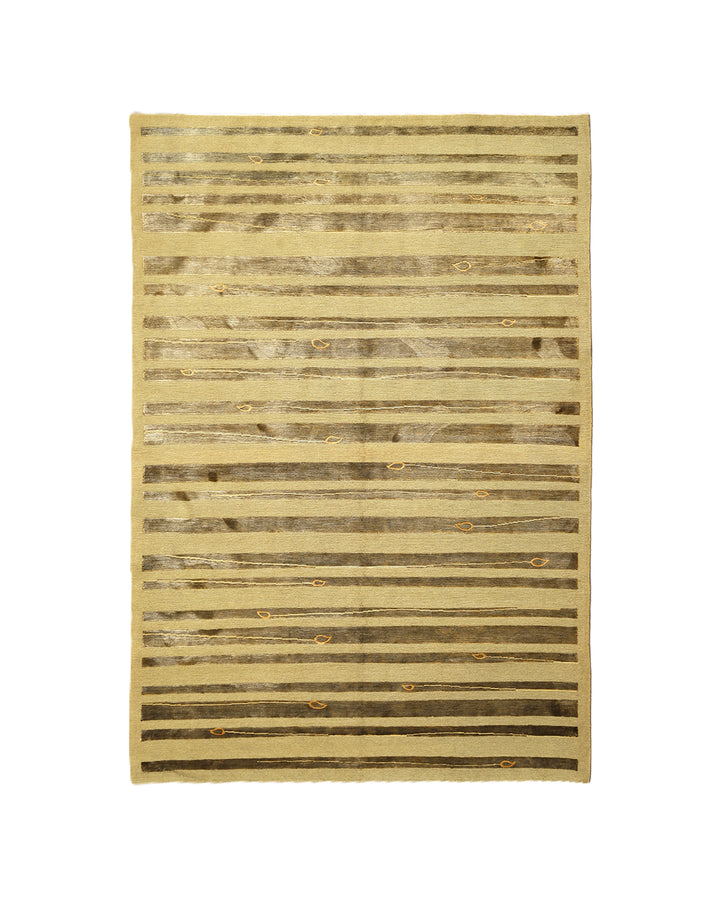 Hand-knotted Modern Tibetan Ariana rug in wool and silk featuring a geometric pattern in gold and greenish hues