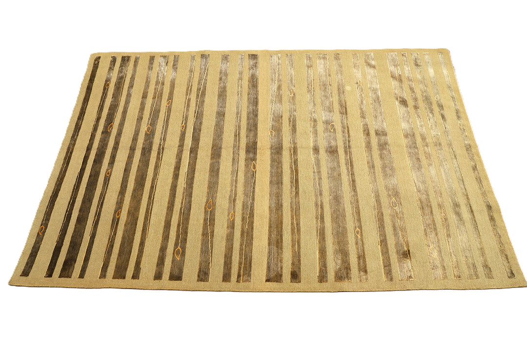 Hand-knotted Modern Tibetan Ariana rug in wool and silk featuring a geometric pattern in gold and greenish hues
