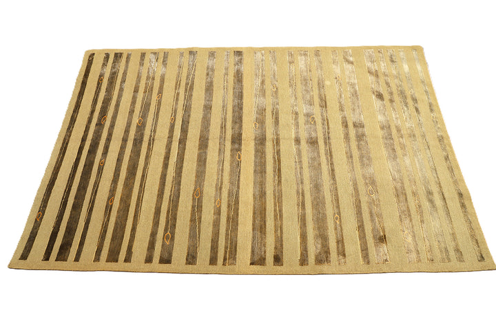 Hand-knotted Modern Tibetan Ariana rug in wool and silk featuring a geometric pattern in gold and greenish hues