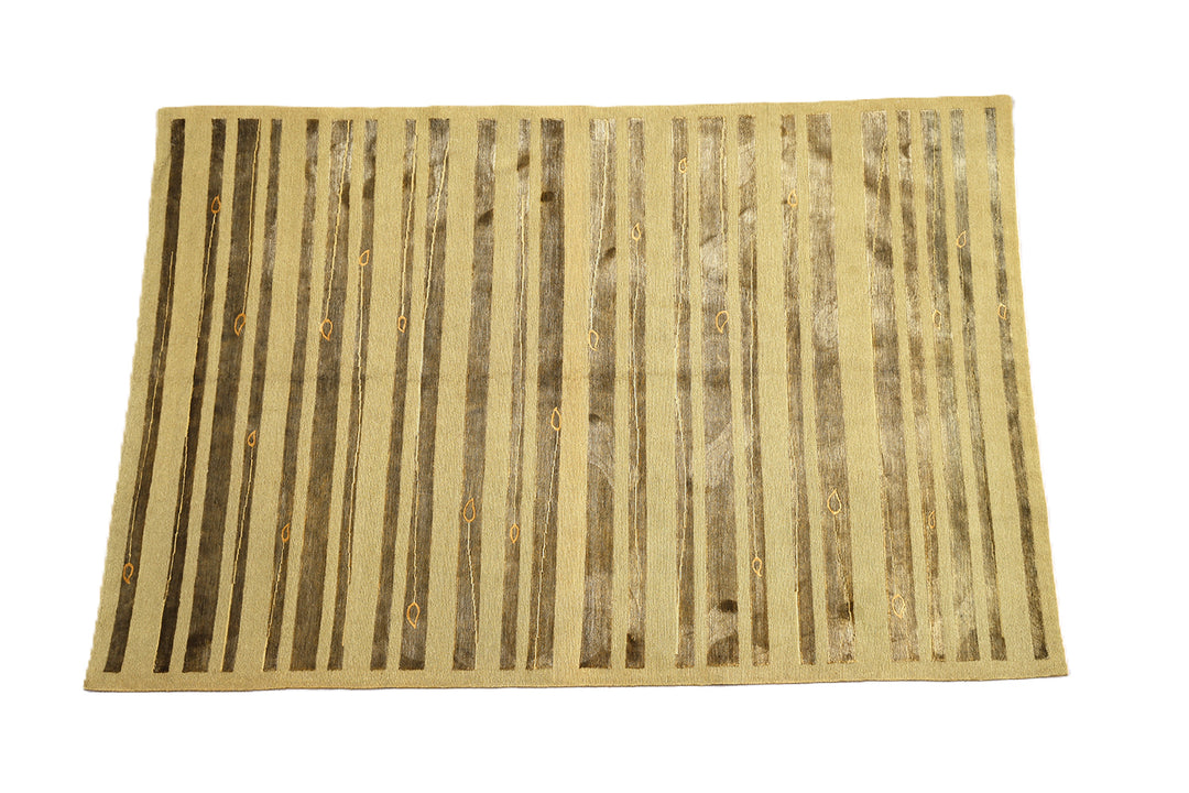 Hand-knotted Modern Tibetan Ariana rug in wool and silk featuring a geometric pattern in gold and greenish hues