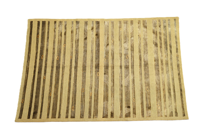 Hand-knotted Modern Tibetan Ariana rug in wool and silk featuring a geometric pattern in gold and greenish hues