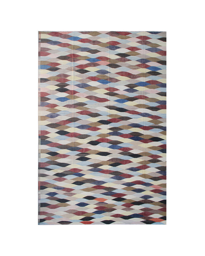 Multicolored geometric patterned rug on a white background