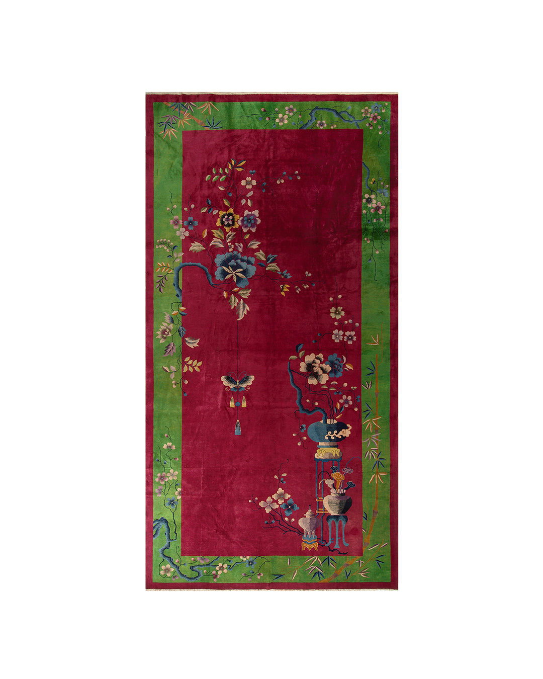 A monumental 10x19 vintage Chinese Art Deco rug in perfect condition with a vibrant red field, green floral borders, and luxurious full wool pile.